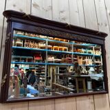 Louis XVI style mirror in mahogany and gold.