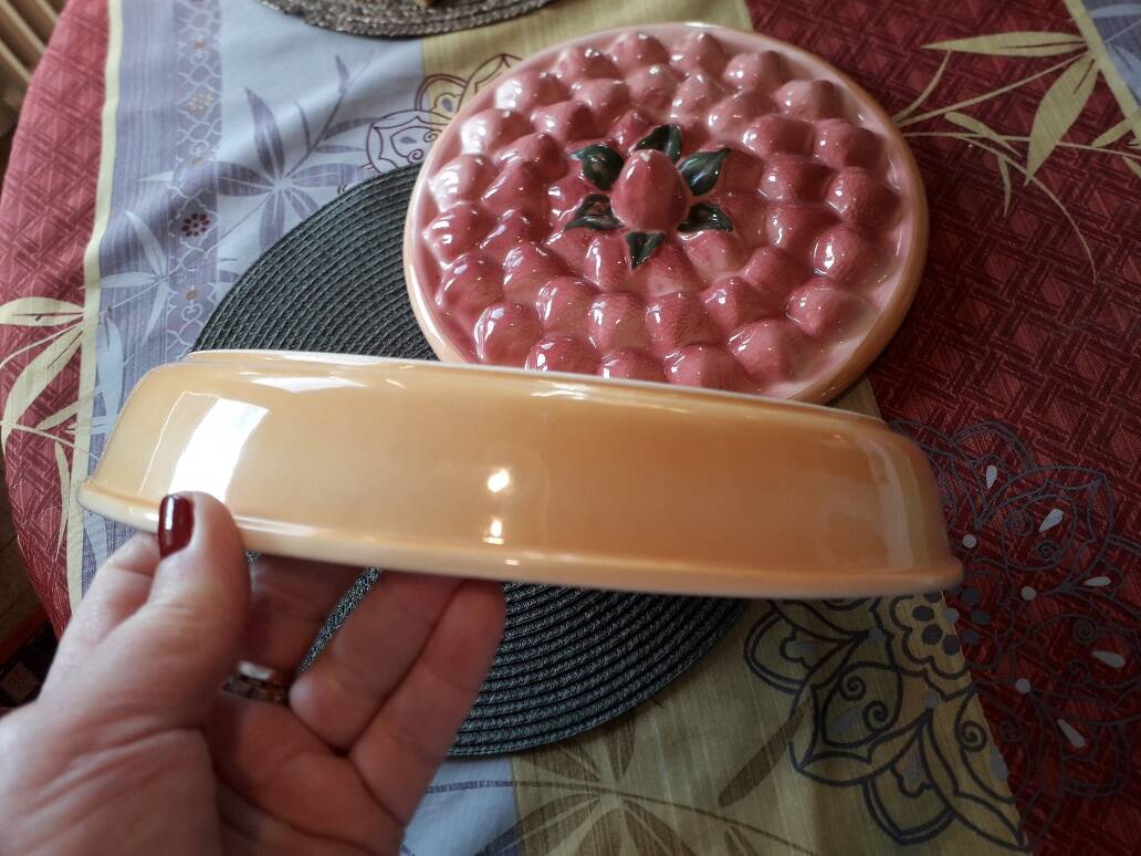 Glazed ceramic dessert plate with strawberry design.