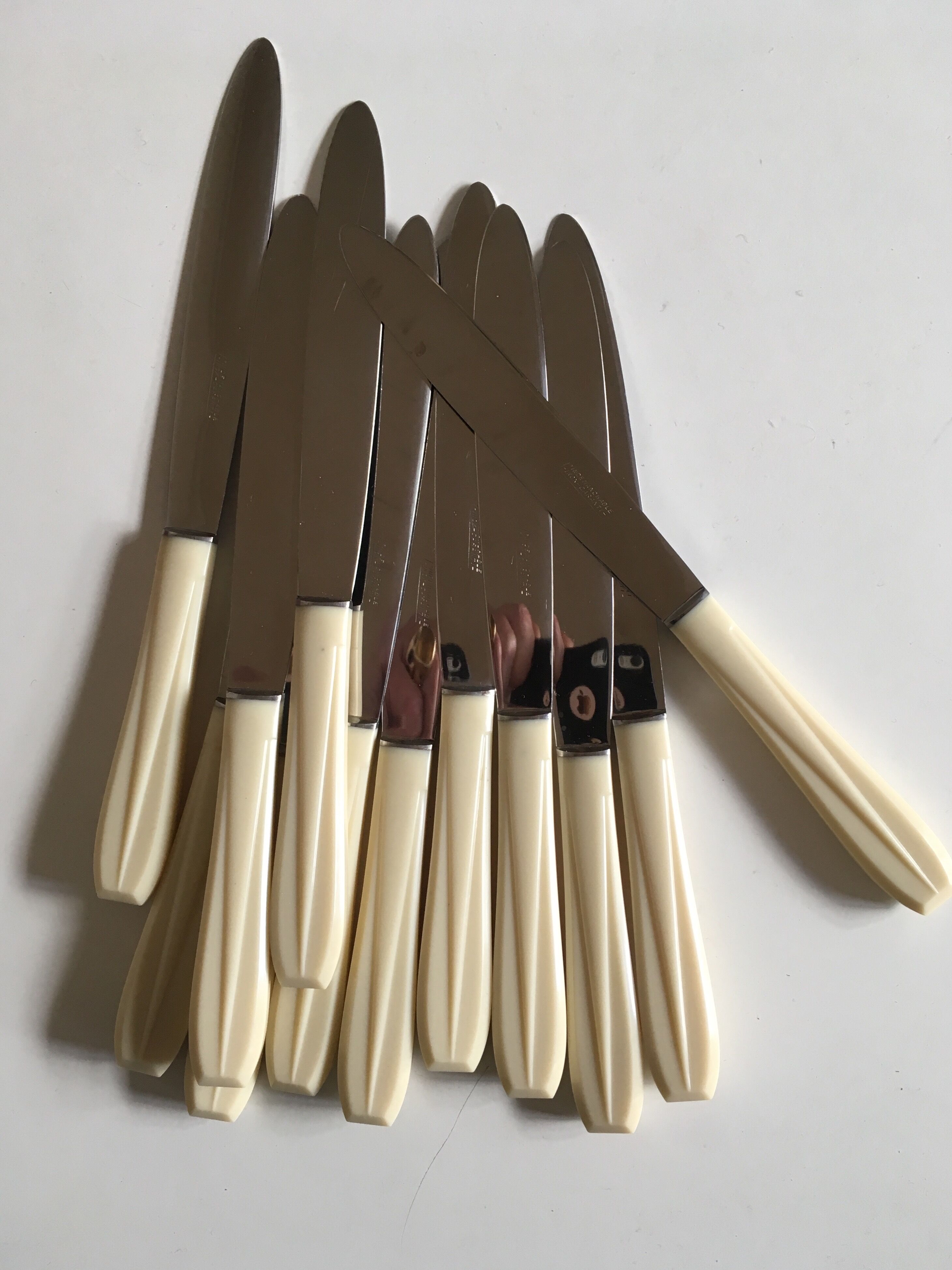 Set of 12 knives in white bakelite 50s