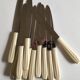 Set of 12 knives in white bakelite 50s