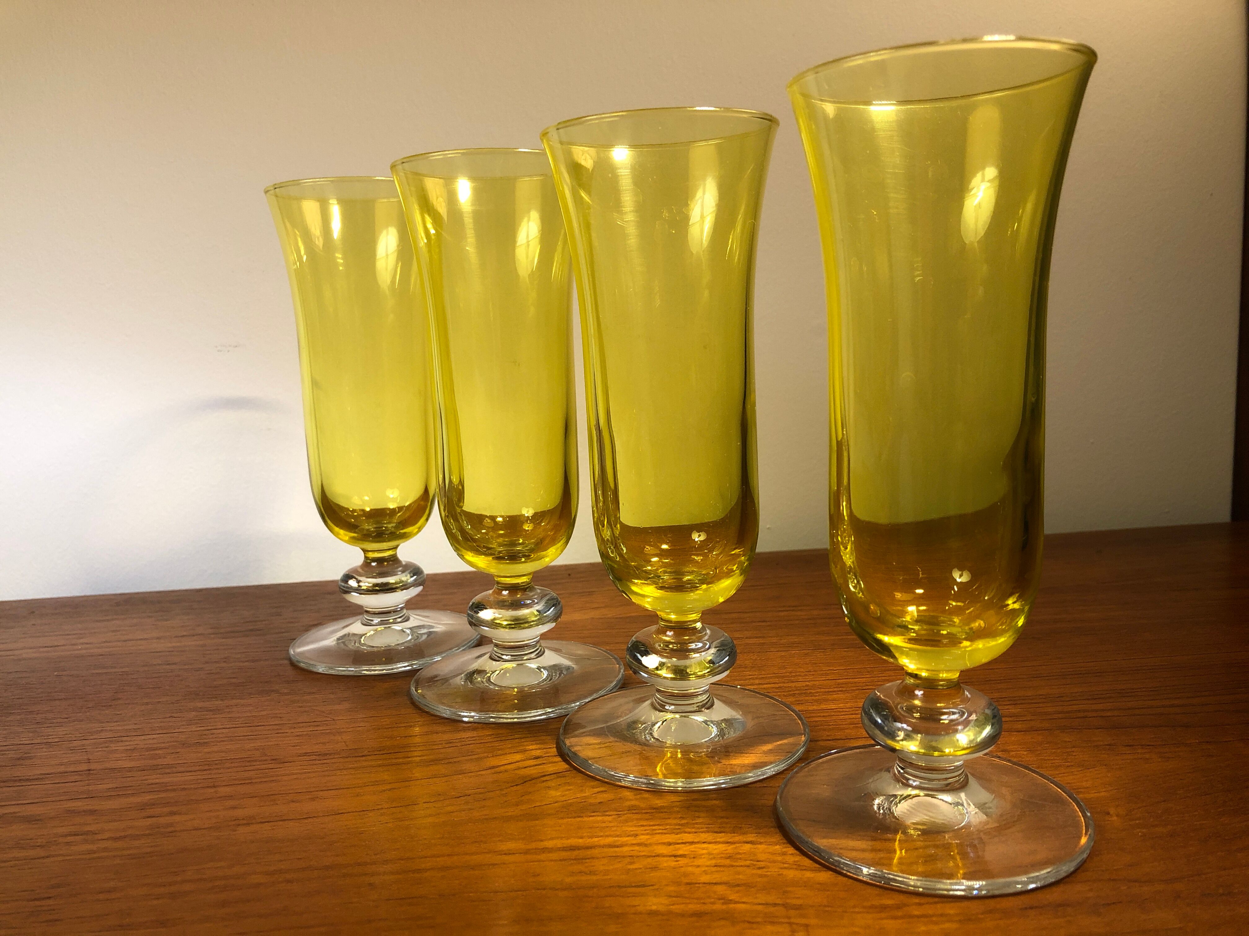 Large transparent yellow champagne flutes