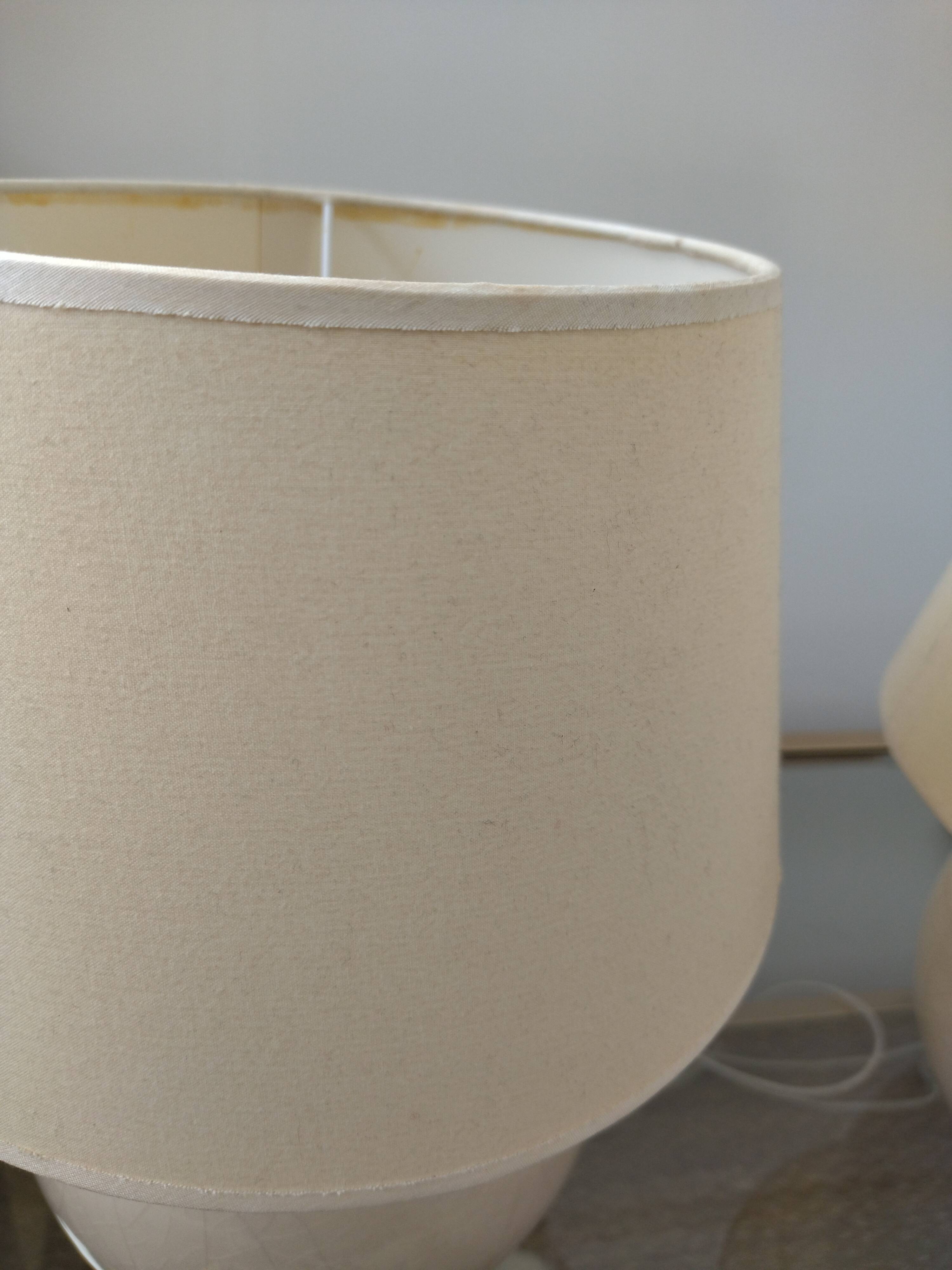 Pair of cracked white Kostka lamps
