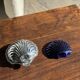 Vintage silver-plated shell butter dish with blue bowl.