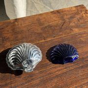 Vintage silver-plated shell butter dish with blue bowl.