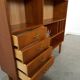 Deens teak vakkenkast met lades en hoge poten, vintage wandkast