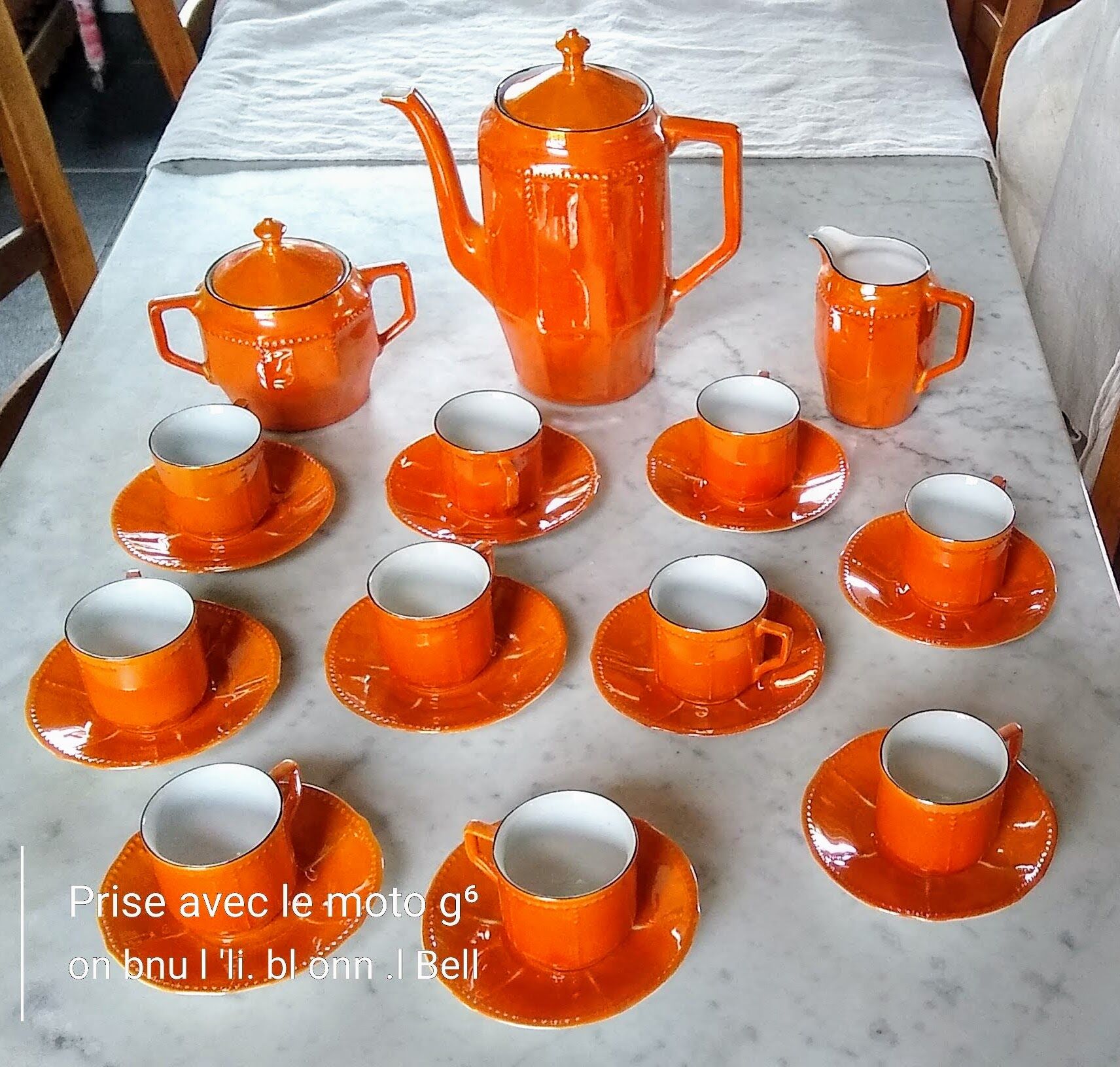 Iridescent orange porcelain coffee set from the 50s-60s with black edging