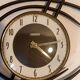 Bayard ortf wall clock in black metal and gilded brass. 1960