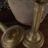 Pair of brass torch candle holders with pushers