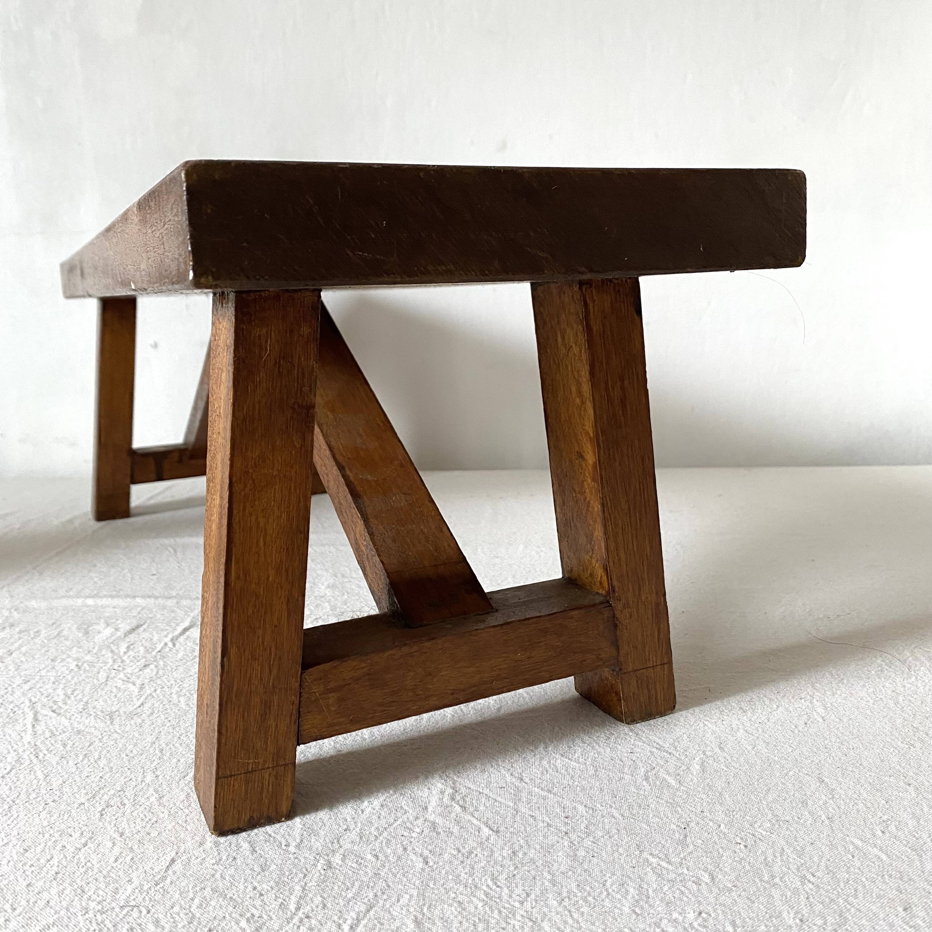 Low stool in varnished wood