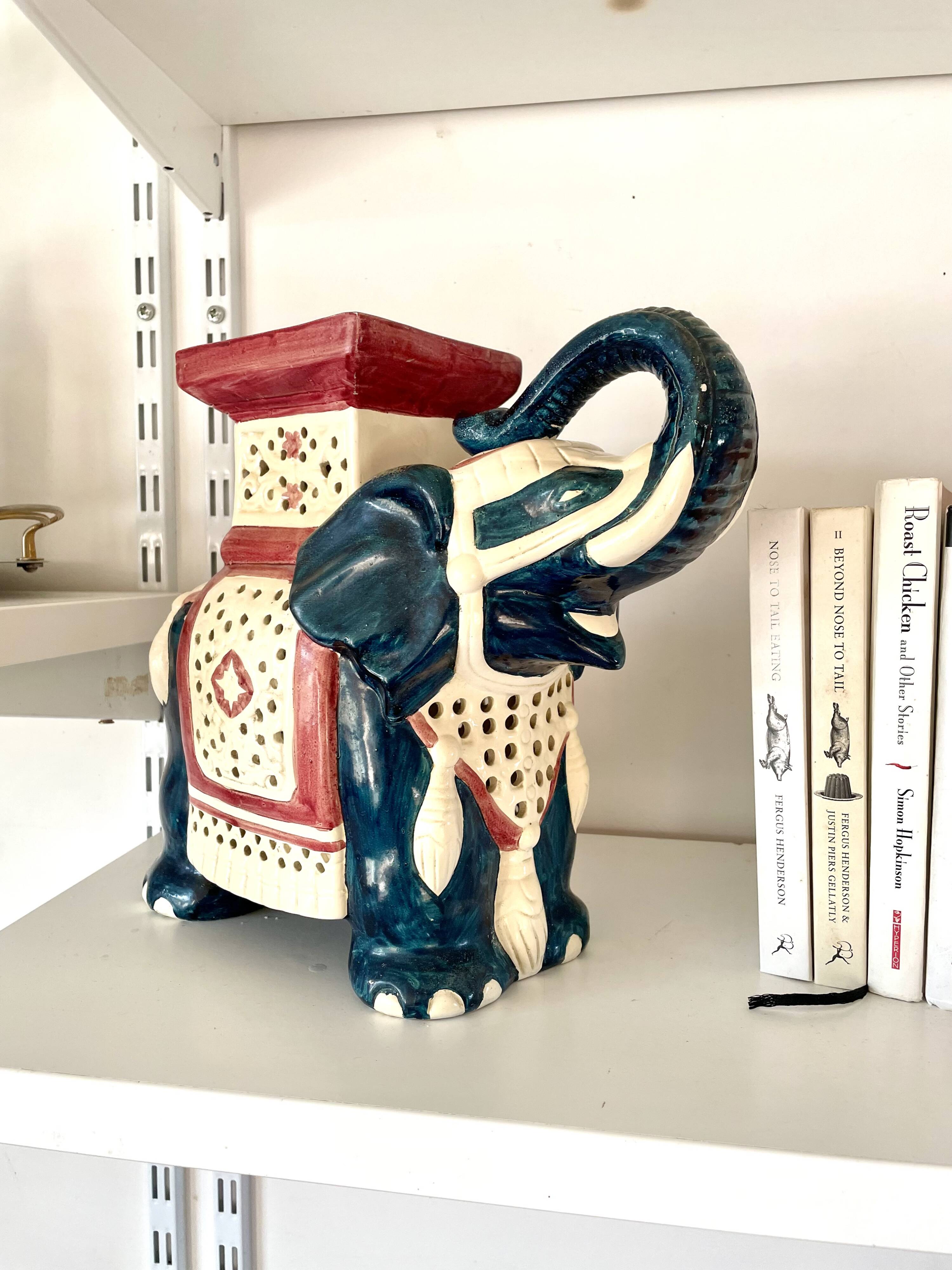 Blue and red ceramic elephant plant stand