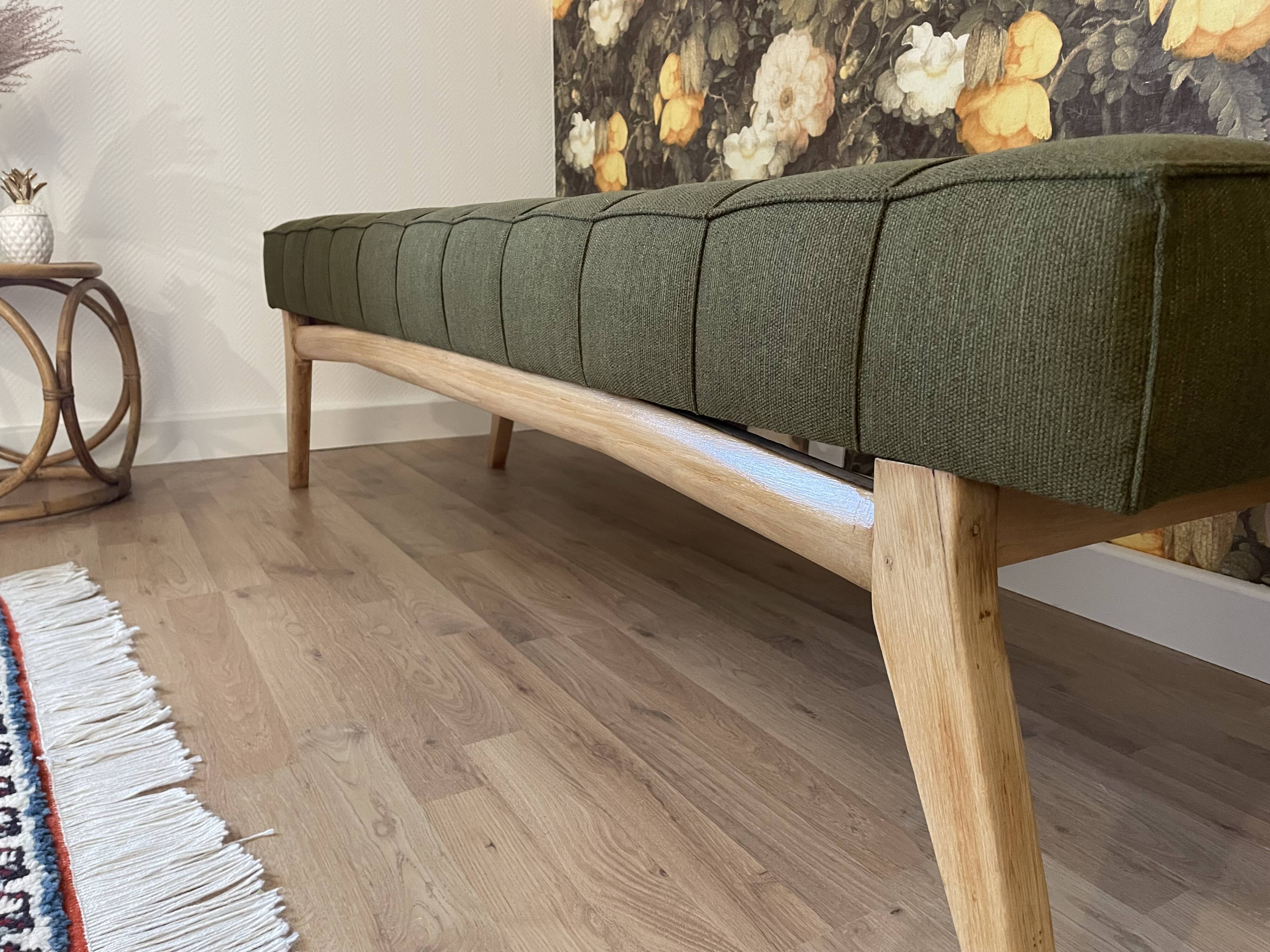 Wooden bench and green fabric