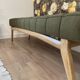 Wooden bench and green fabric