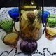 Old Italian alcohol decanter and its colorful glasses