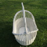 White wicker cradle basket