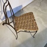 Wrought iron chair with woven seat
