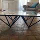 Design coffee table in glass and black metal – Geometric base