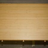 Small bamboo desk with three drawers.