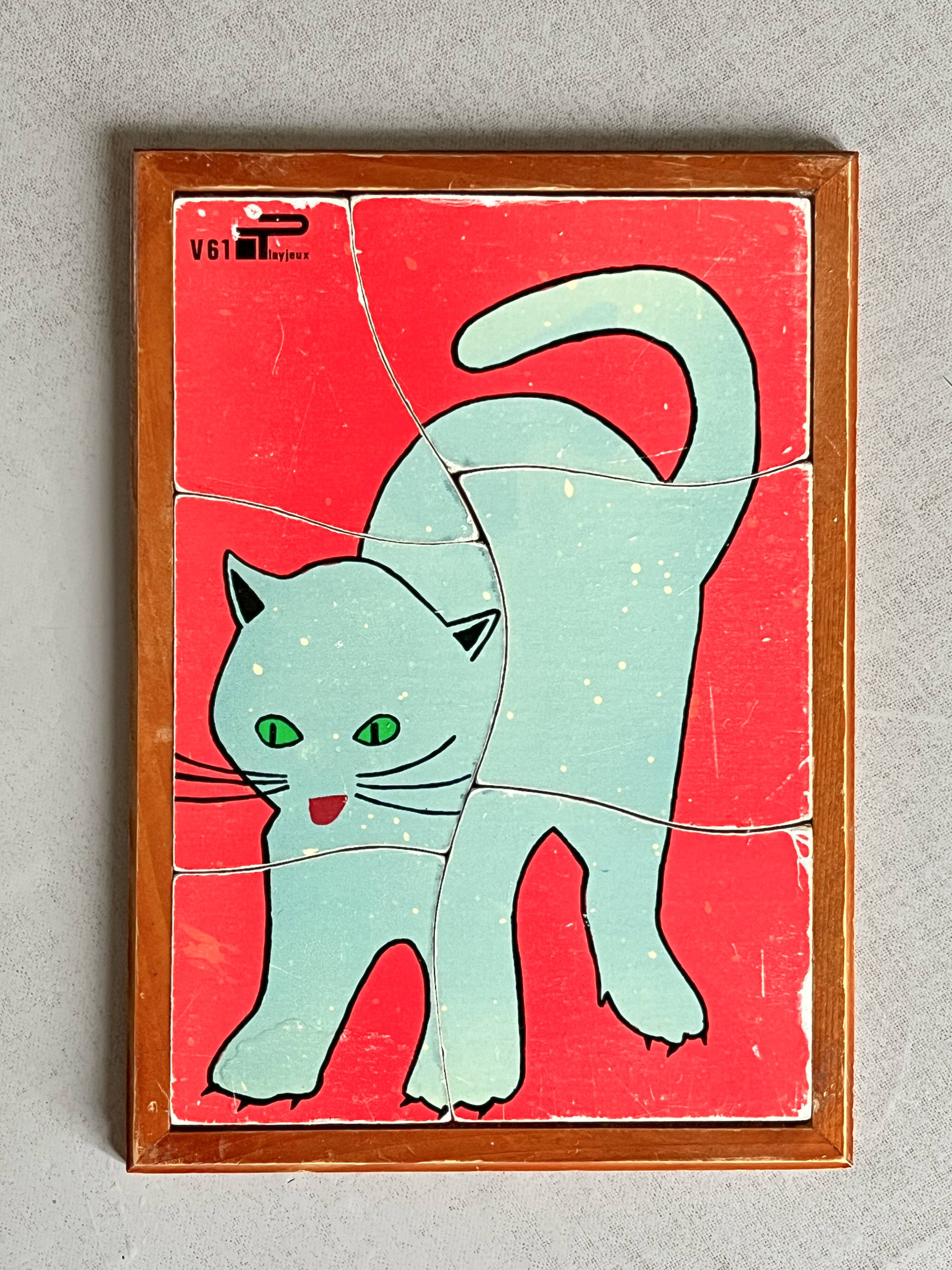 Wooden frame puzzle from the 1960s depicting a cat.