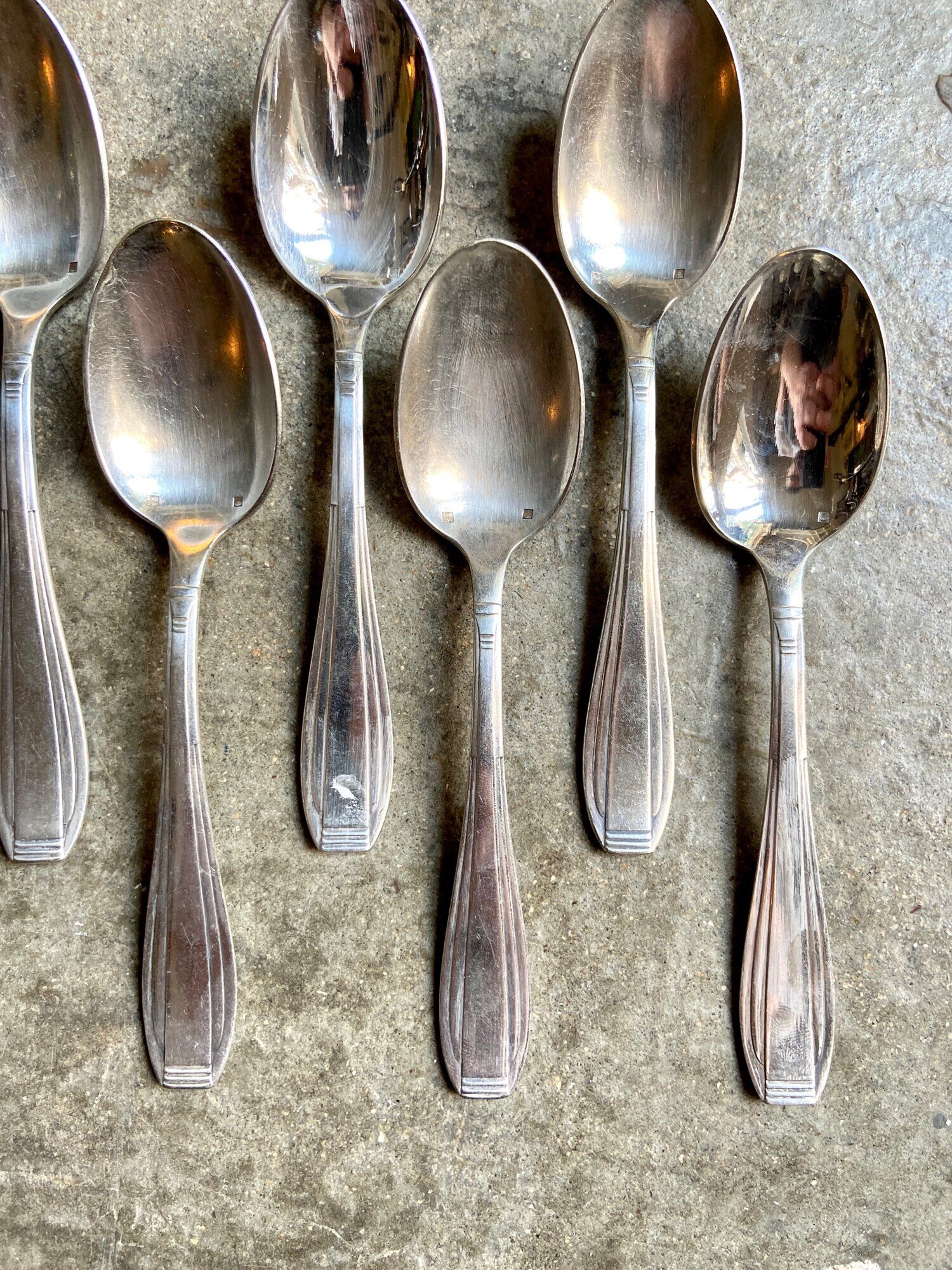 6 silver metal spoons