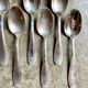 6 silver metal spoons