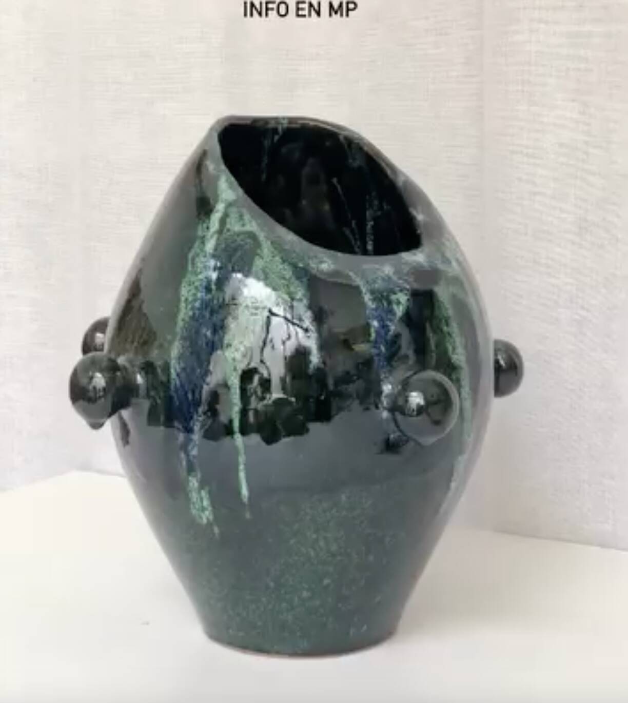 Glazed green and blue ceramic vase.