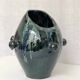 Glazed green and blue ceramic vase.