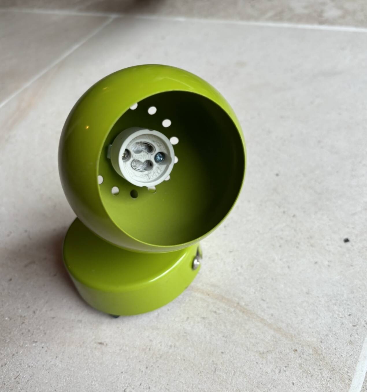 Small vintage metal spotlight in anis green/khaki color.