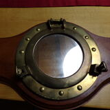 Marine style coat rack with porthole mirror