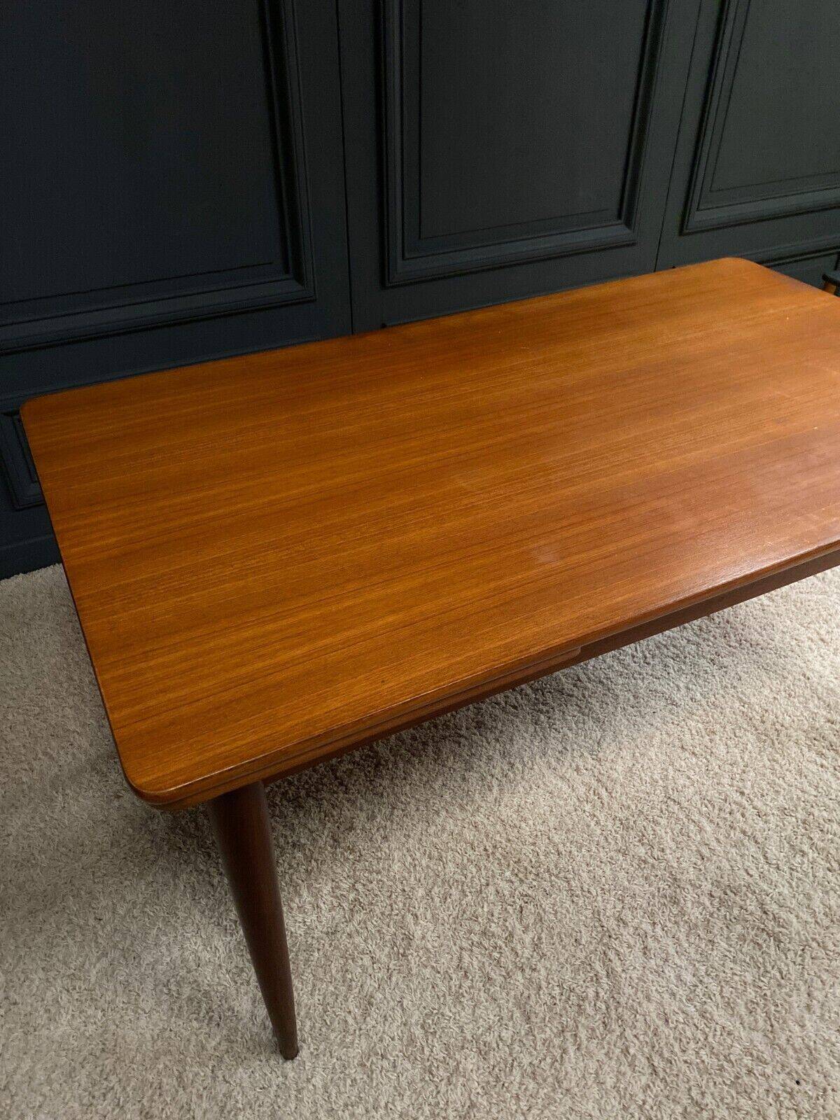 Scandinavian rectangular teak dining table with 4 tapered legs