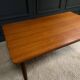 Scandinavian rectangular teak dining table with 4 tapered legs