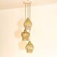 Cascade pendant light with 3 molded glass globes in vintage arabesque amber glass