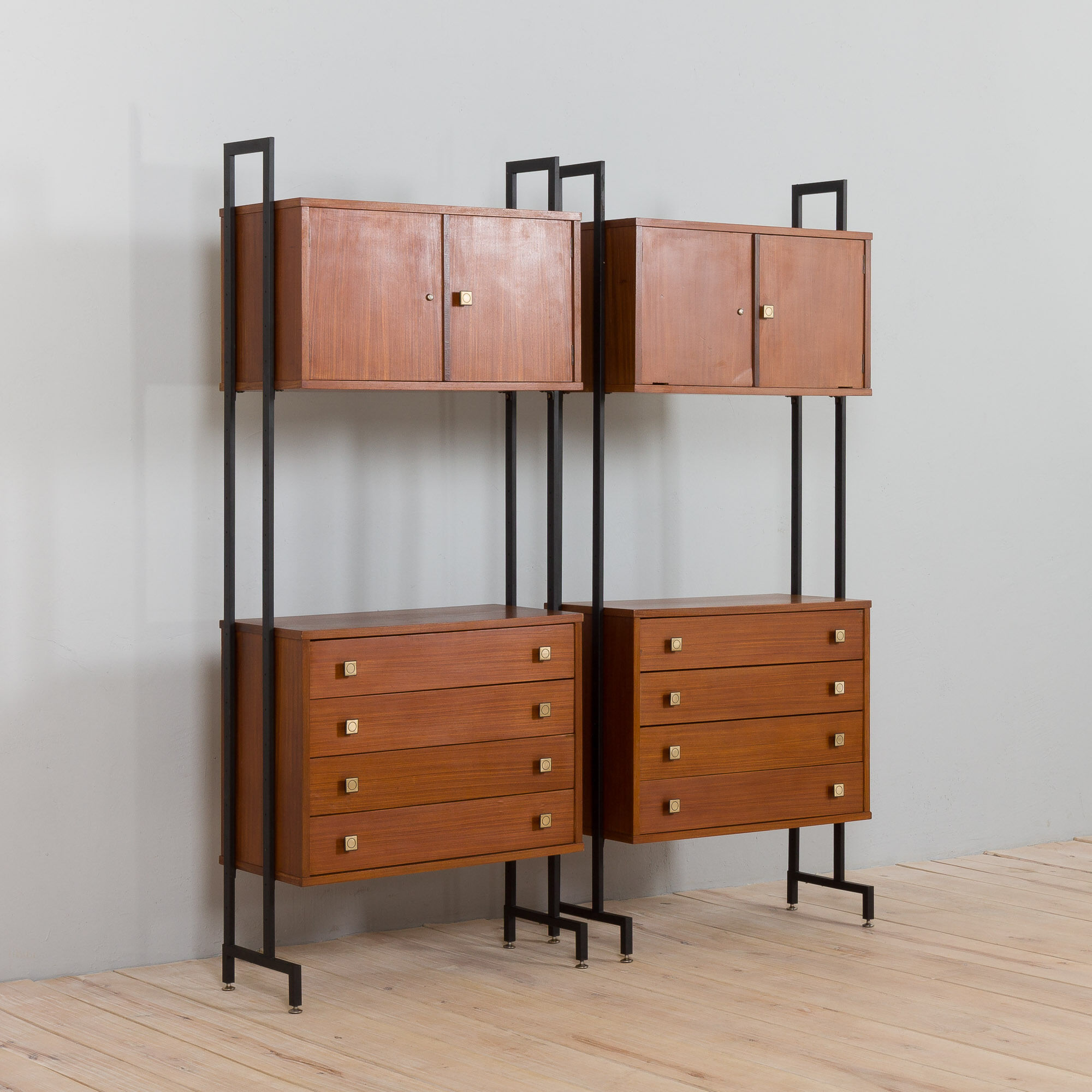 Pair of Italian mid century freestanding wall units in teak with brass handles.