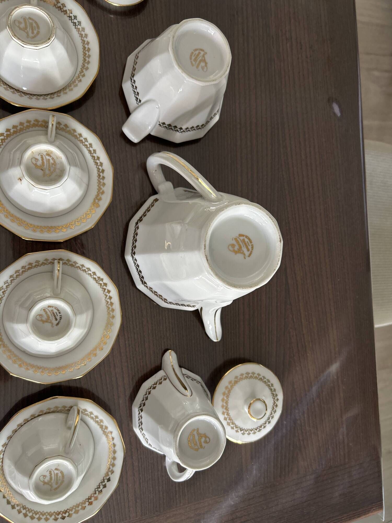 a vintage coffee or tea set in white porcelain with patterns and