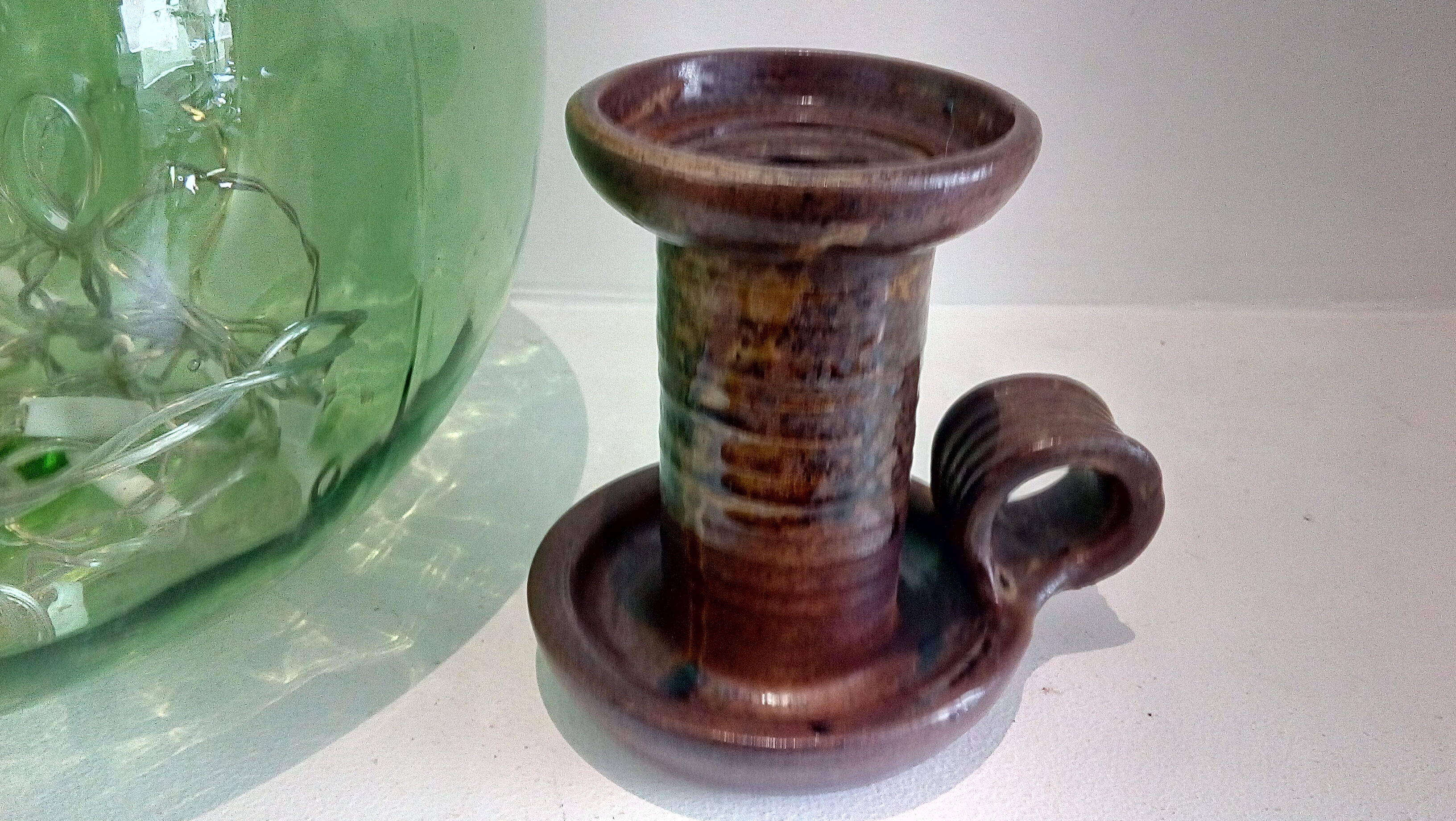 Signed sandstone candle holder