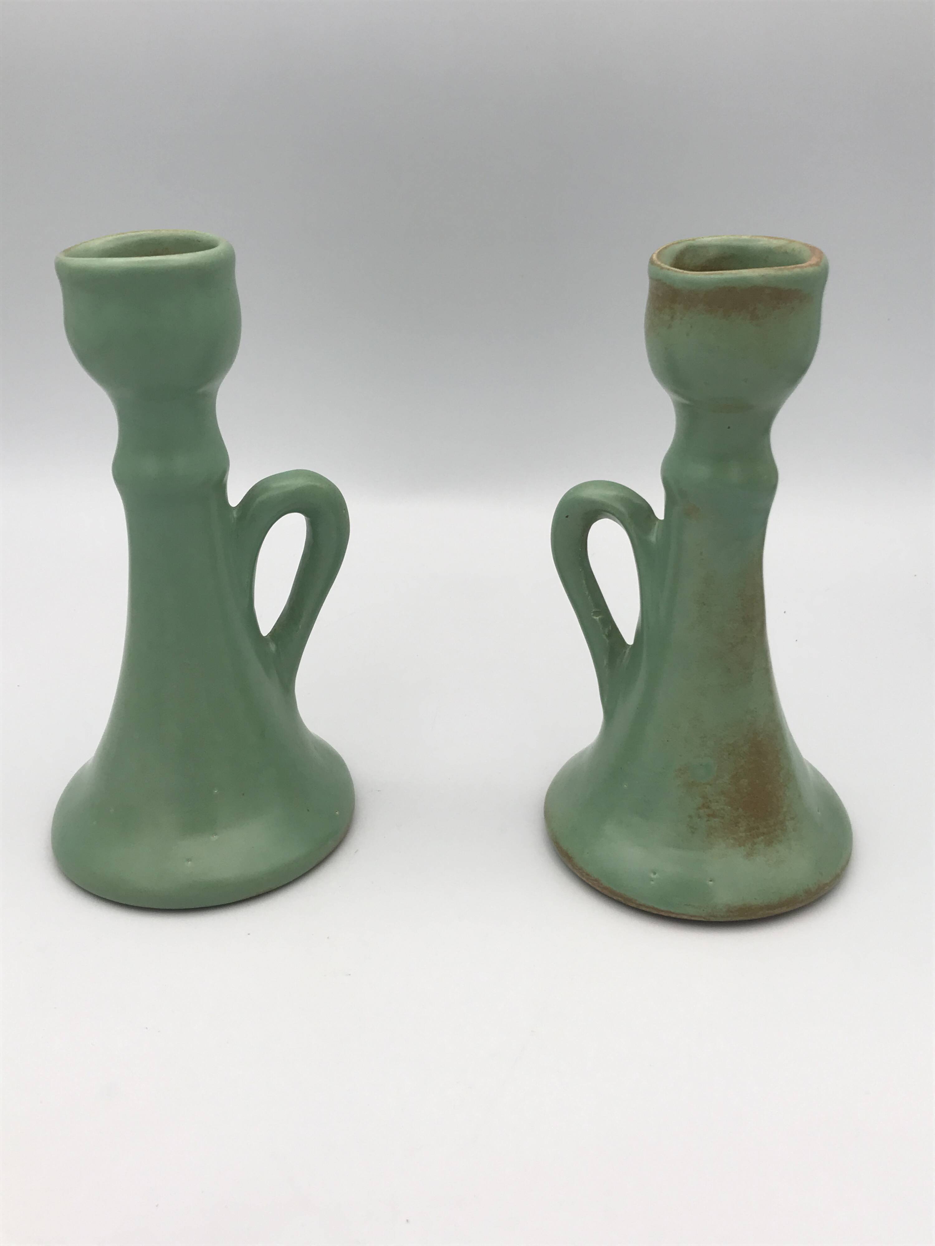 Pair of vintage table candle holders in green enameled ceramic