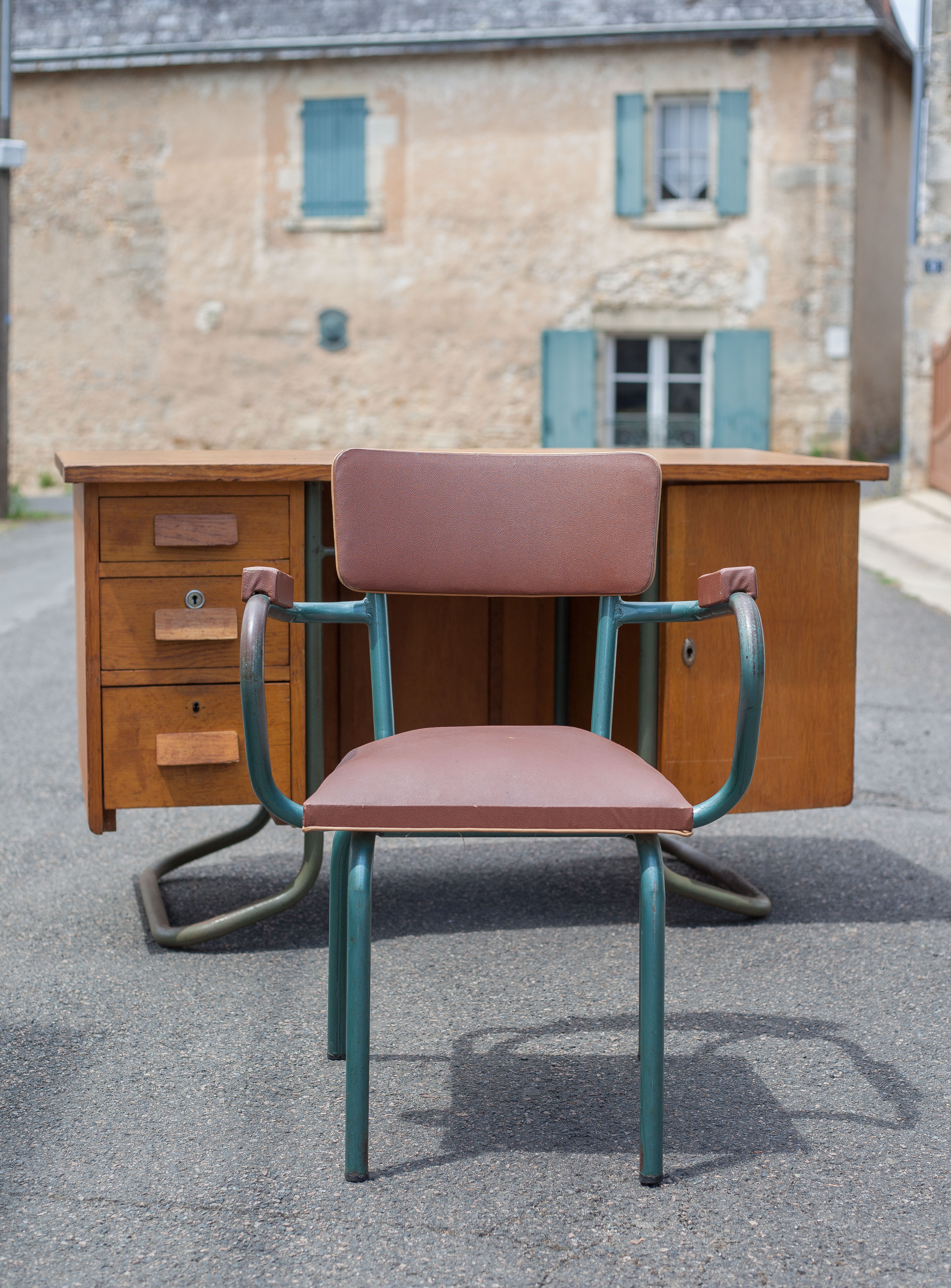 School teacher's chair in imitation leather and tubular metal