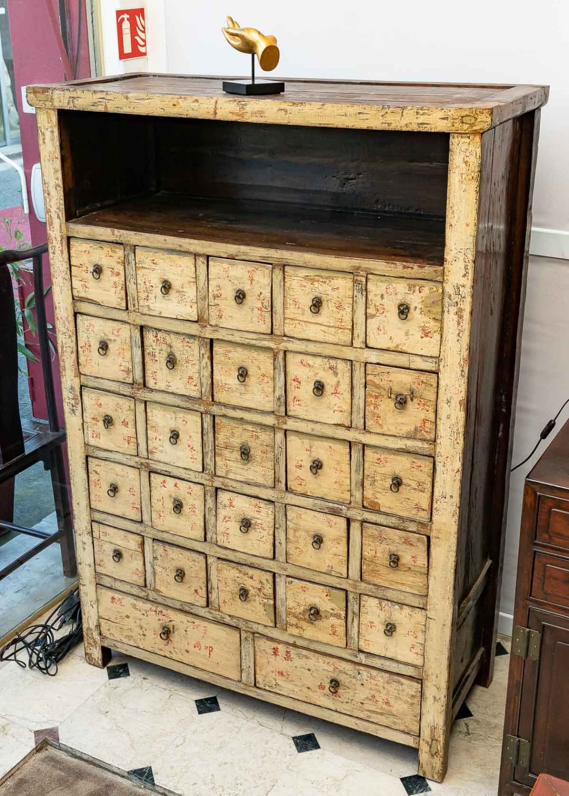 Antique Chinese apothecary cabinet with calligraphy