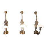 Trio of vintage coat hooks.