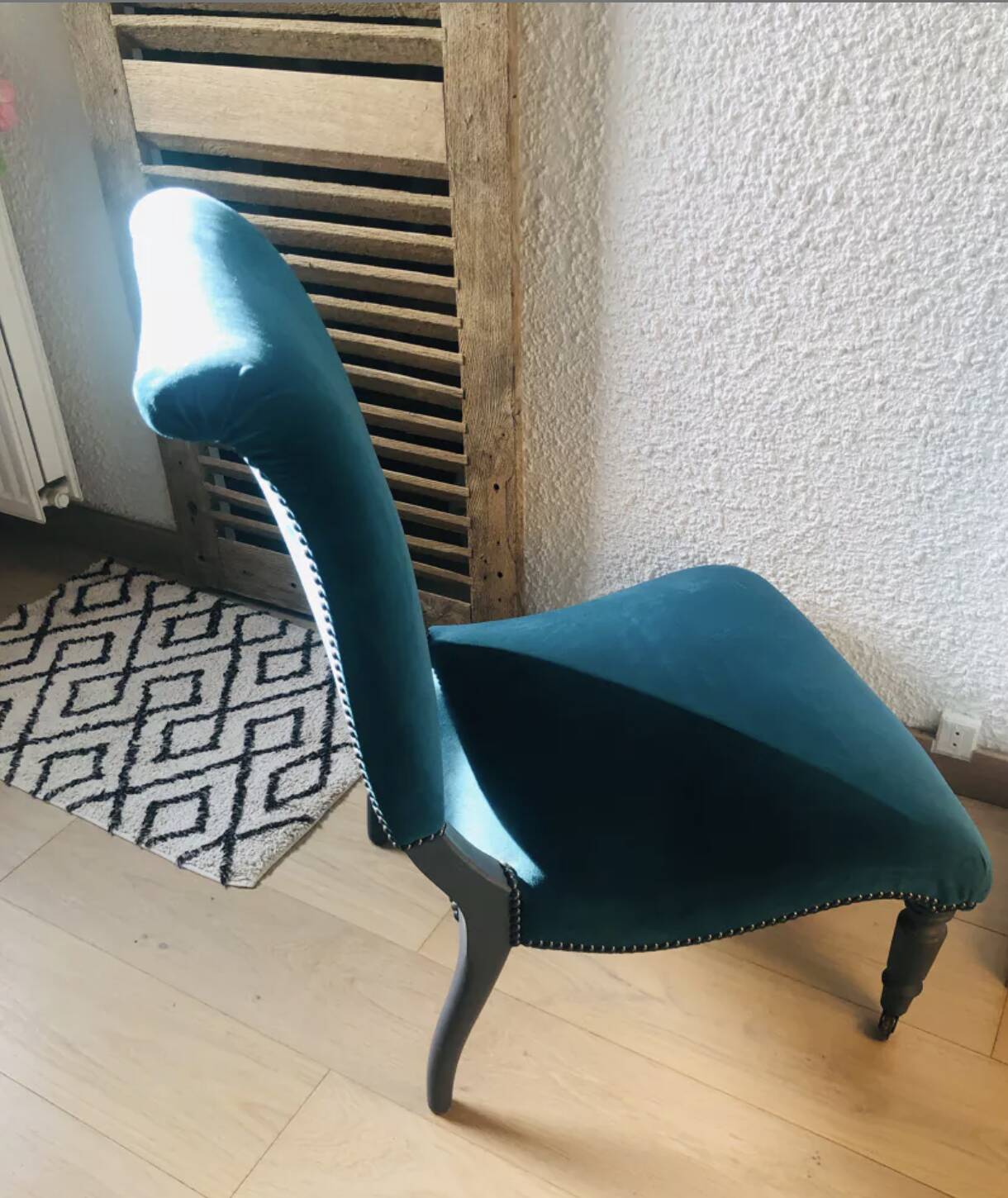 Velvet and studded armchair