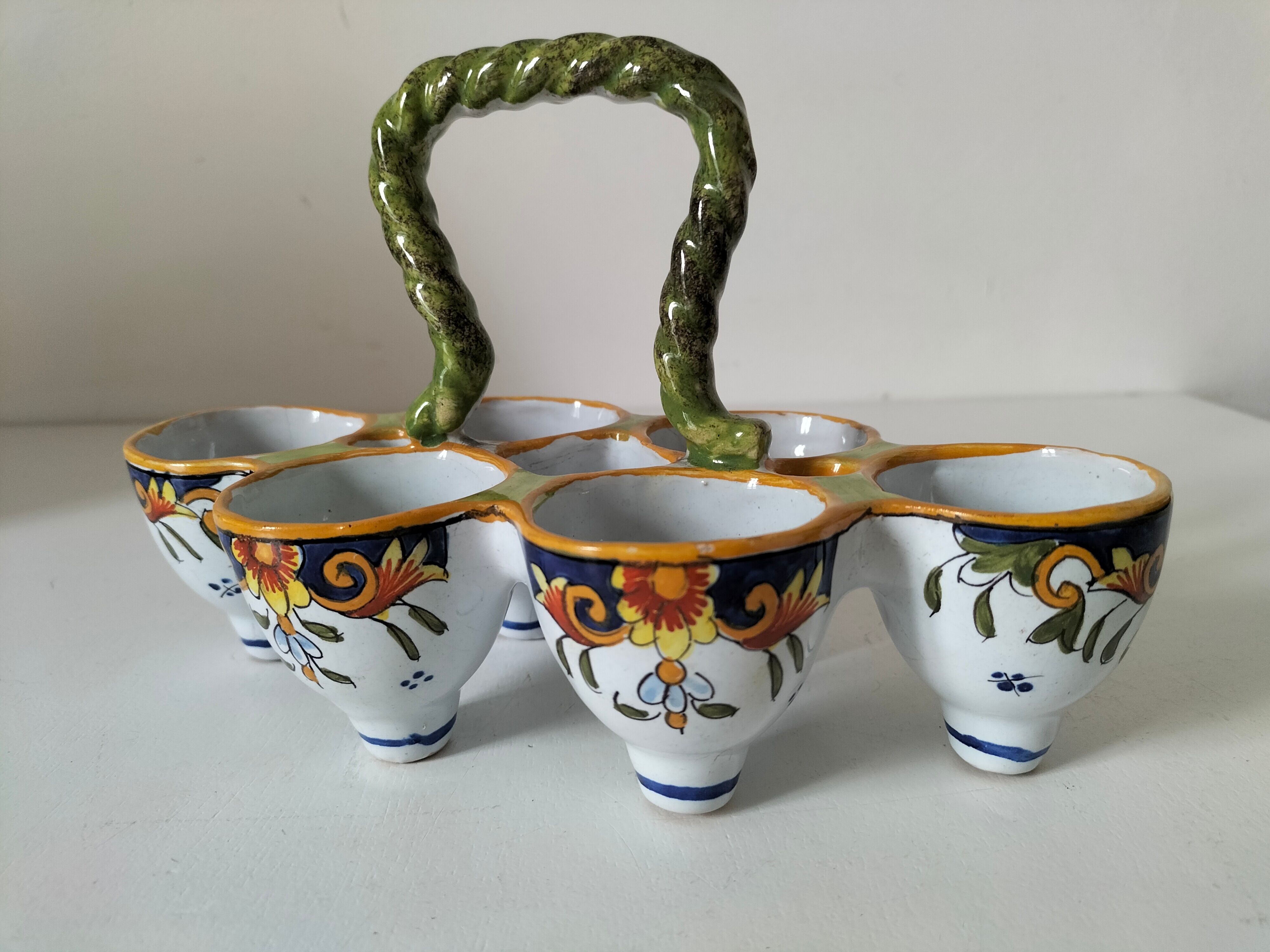 Antique egg holder by Jules Verlingue with polychrome floral decoration.