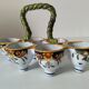 Antique egg holder by Jules Verlingue with polychrome floral decoration.