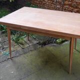 wooden dining table with compass legs and extensions
