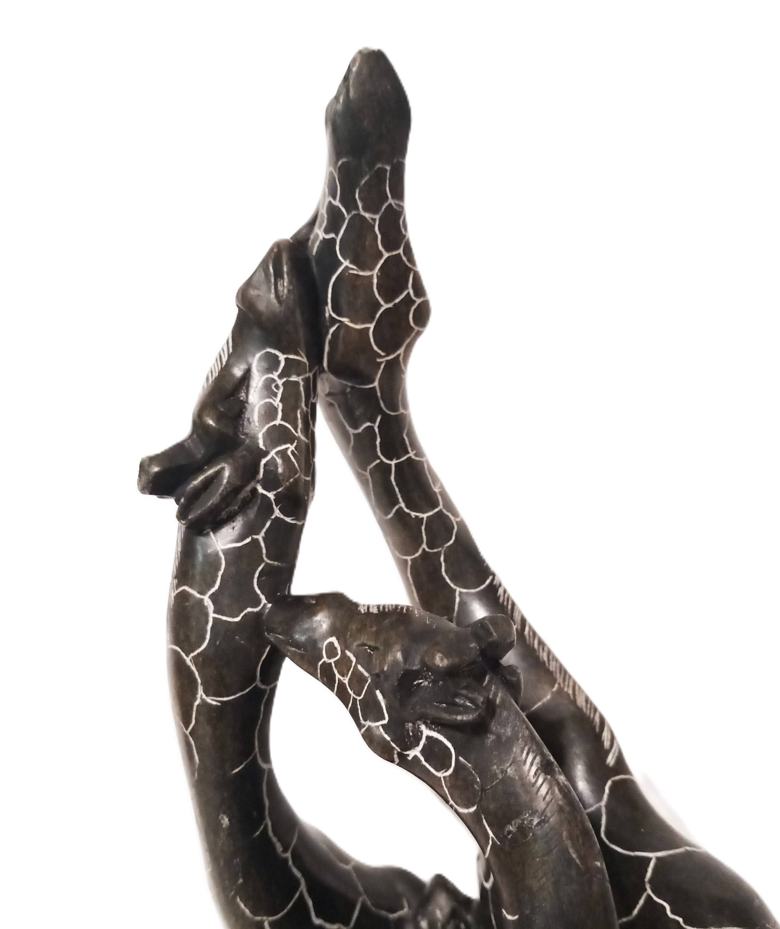 African stone sculpture of 3 Giraffes