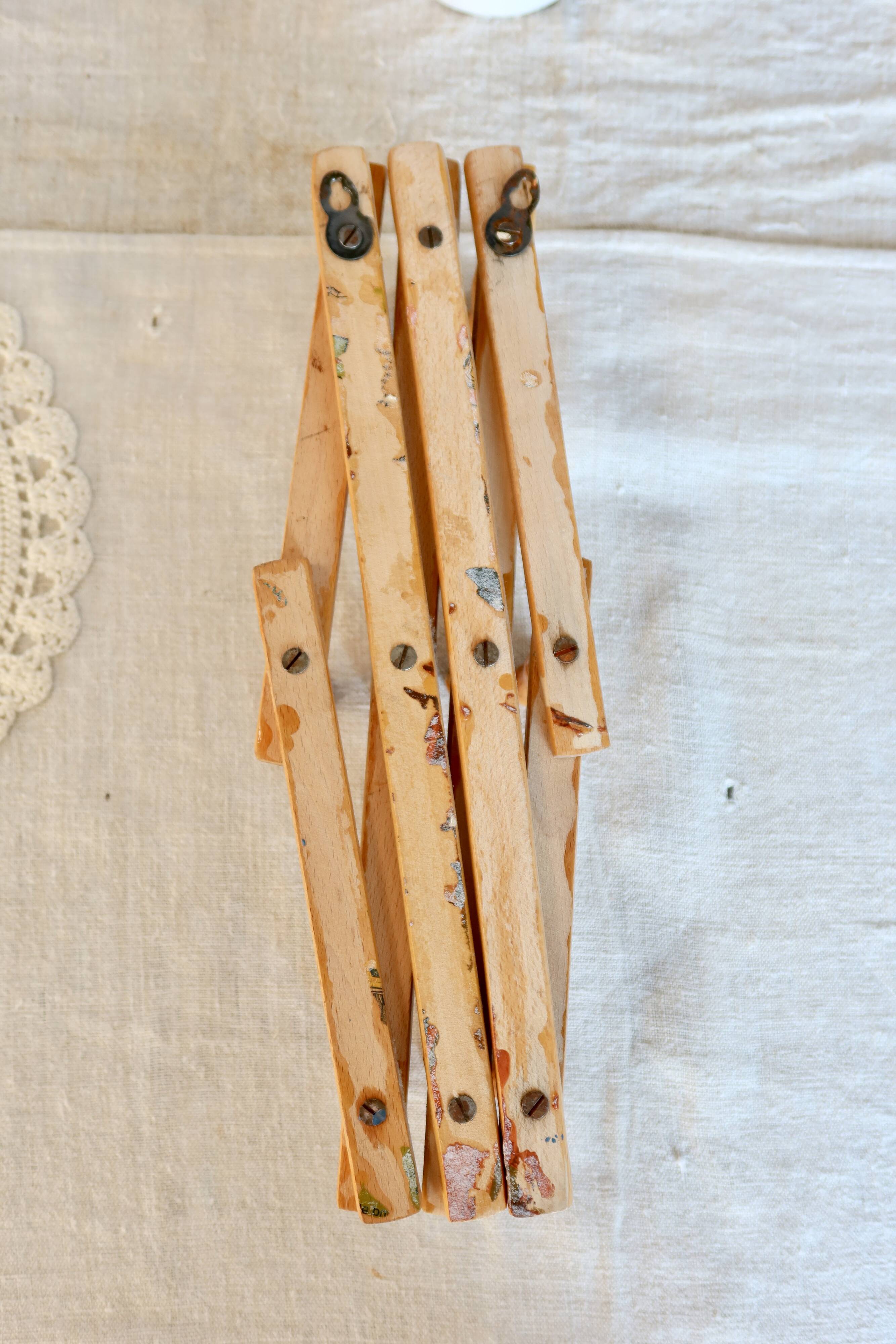 Vintage retractable wall-mounted coat rack made of pine wood