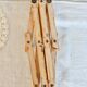 Vintage retractable wall-mounted coat rack made of pine wood