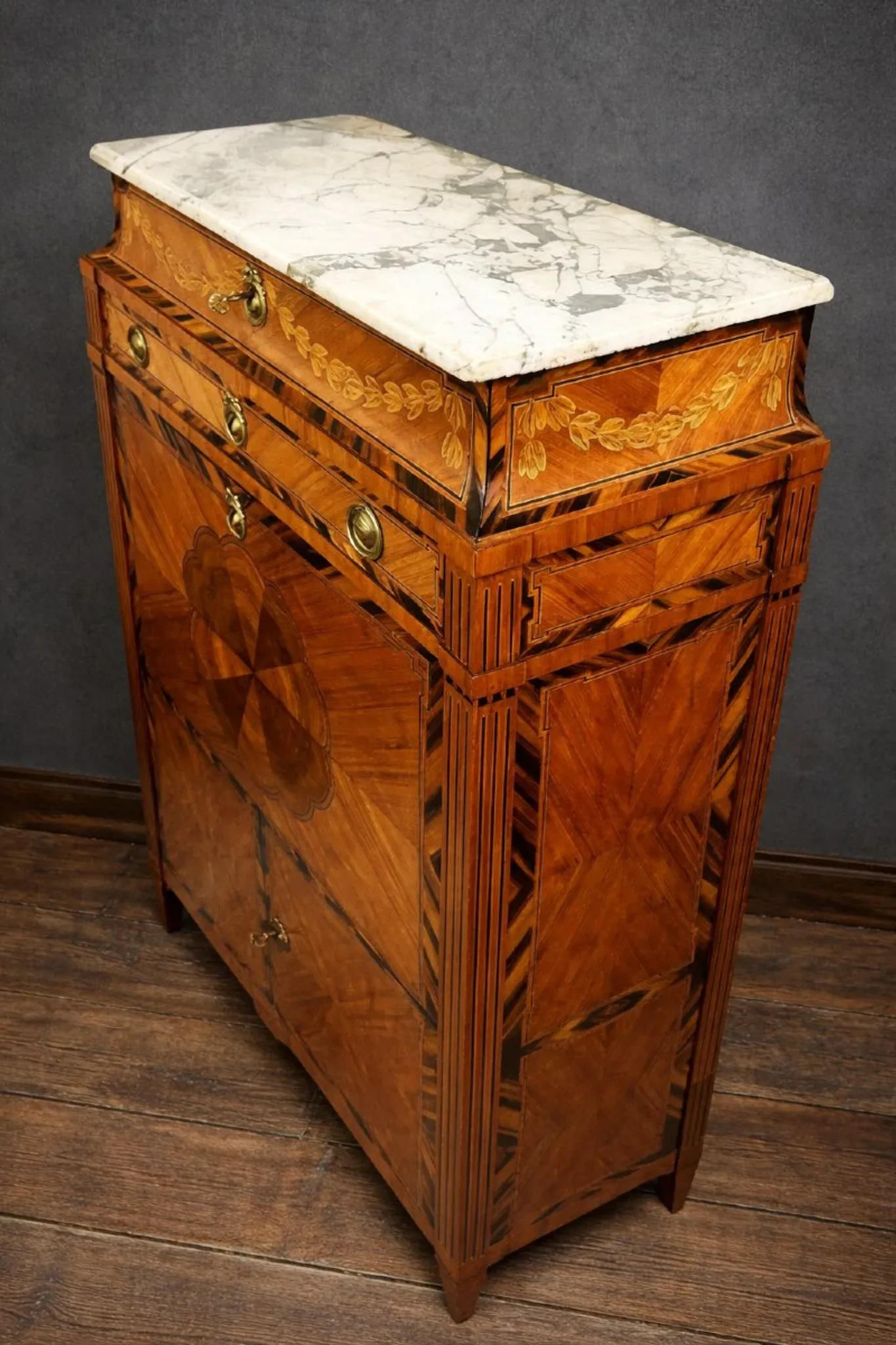 Secretary from the Louis XVI era in precious wood marquetry.