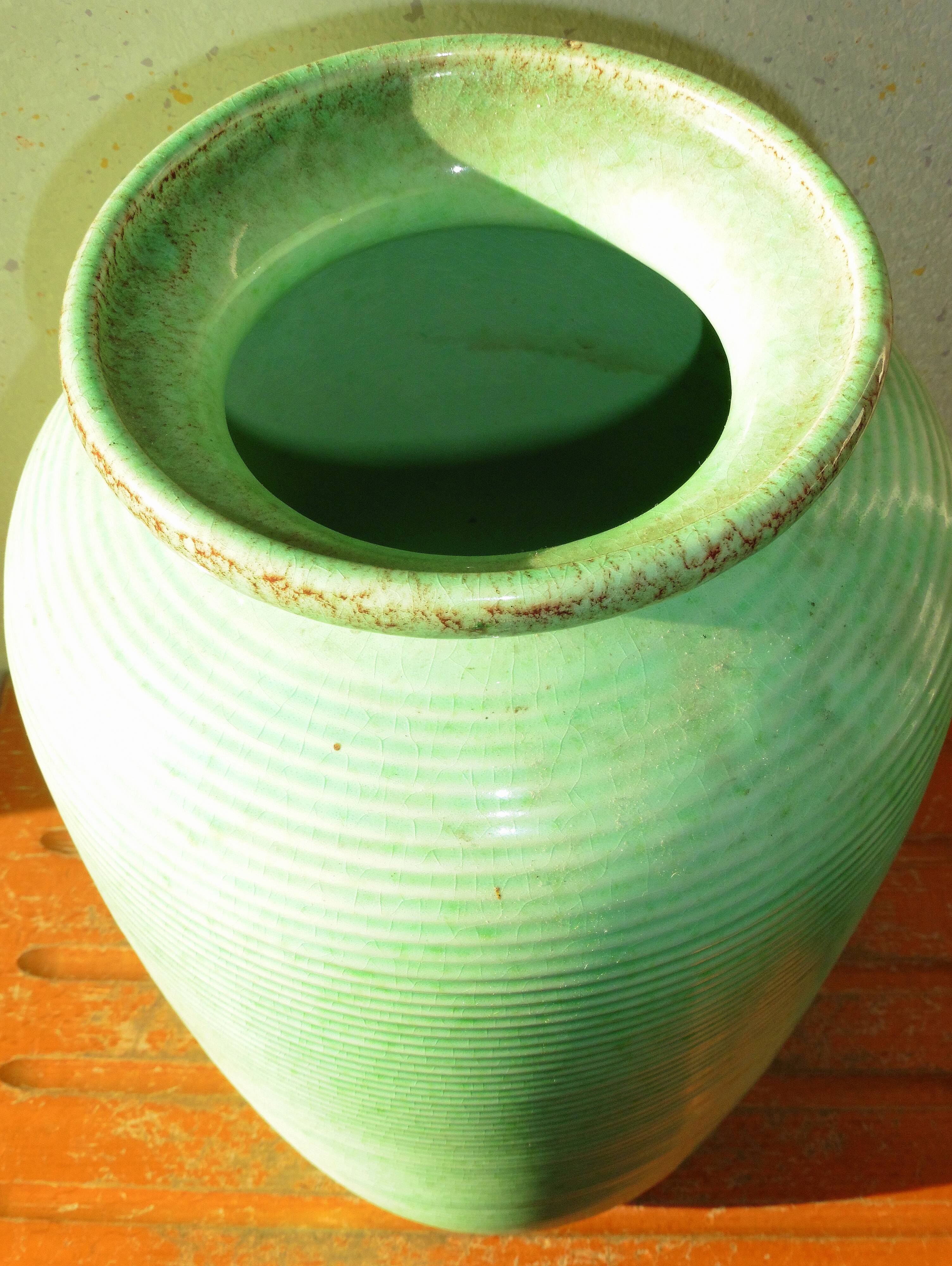 Enamelled earthenware vase with striated pattern