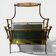 Exceptional magazine rack in brass, smoked glass and Onyx handle.