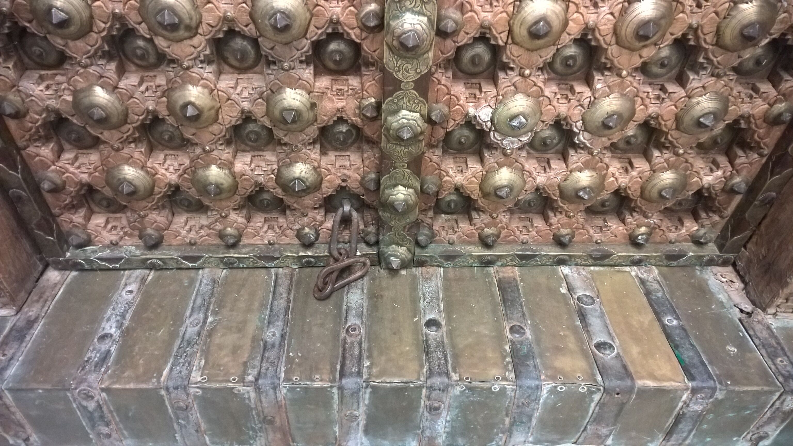 Old crafted teak and brass door
