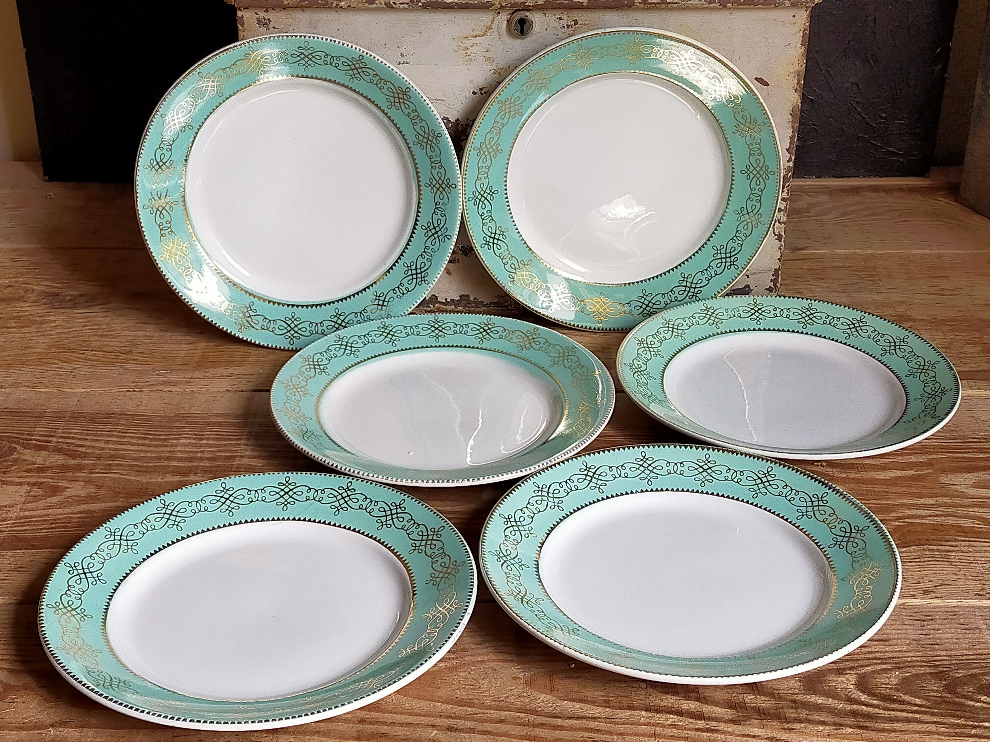 Six plates of vintage Badonviller earthenware with gold frieze